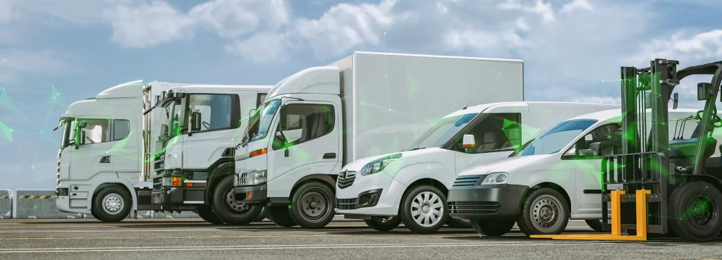 various sized trucks and vans of the transportation sector lined up on a road overlayed witha green plexus