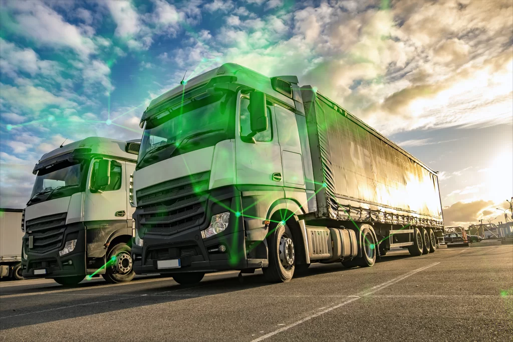 The front of two lorry's taken at a low angle with a green plexus overlayed