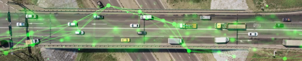 many vehicles along horizontal highway with green plexus overlayed over road