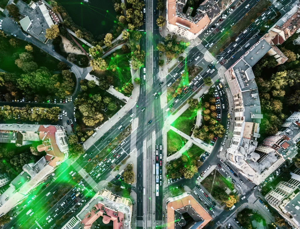 aerial-drone-shot-urban-city-busy-road-intersection-overlayed-with-green-plexus