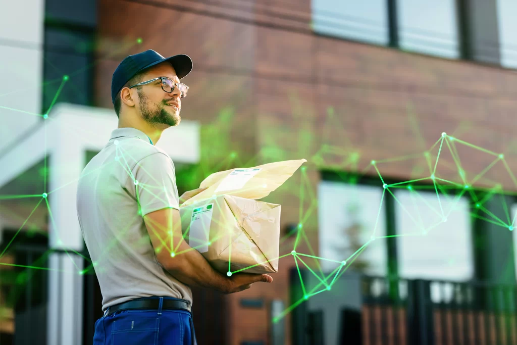 young courier with packages looking right address while making home delivery with green plexus overlayed