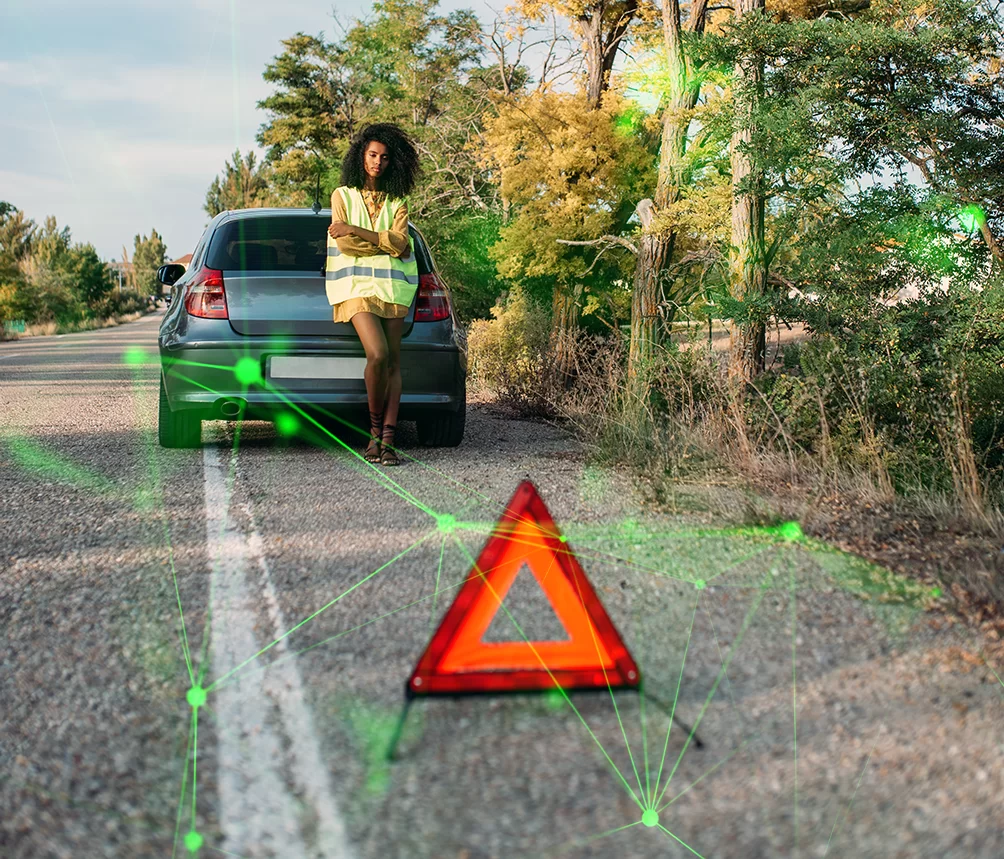 woman with broken car on the hard shoulder with green plexus overlayed
