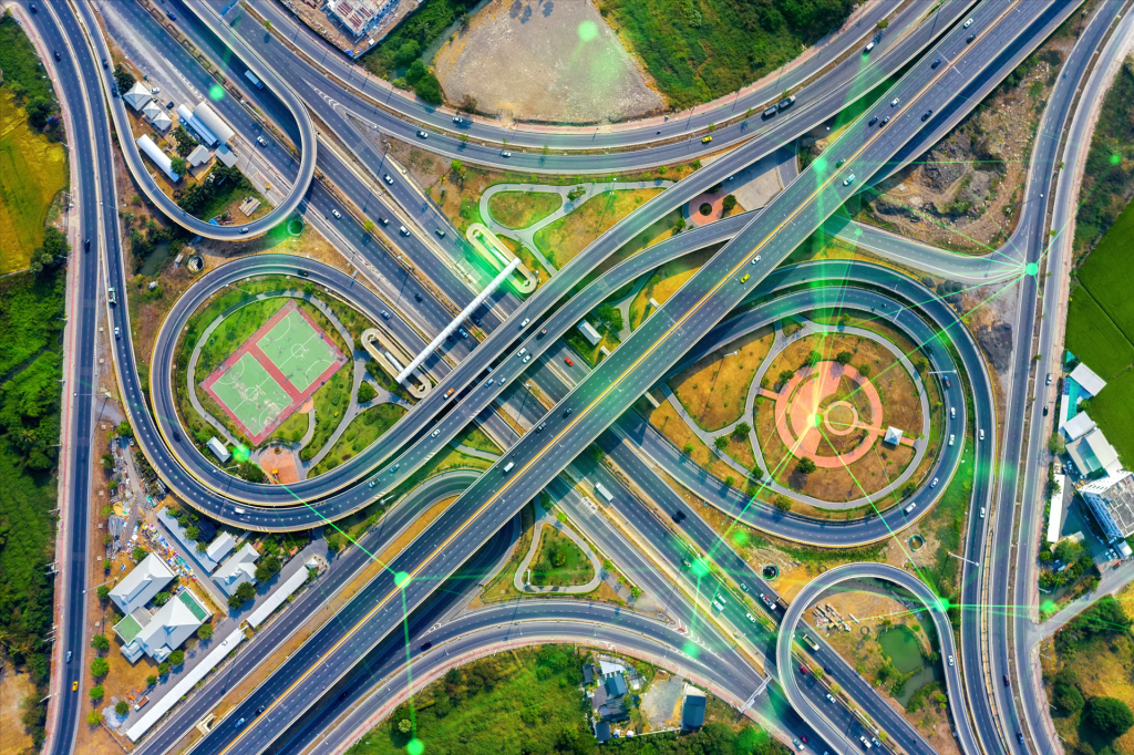 aerial view traffic massive highway intersection with green plexus overlayed