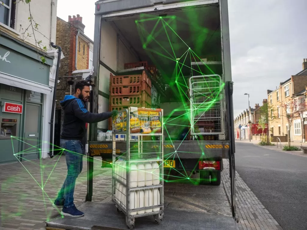 man unloading mil from lorry green plexus overlayed