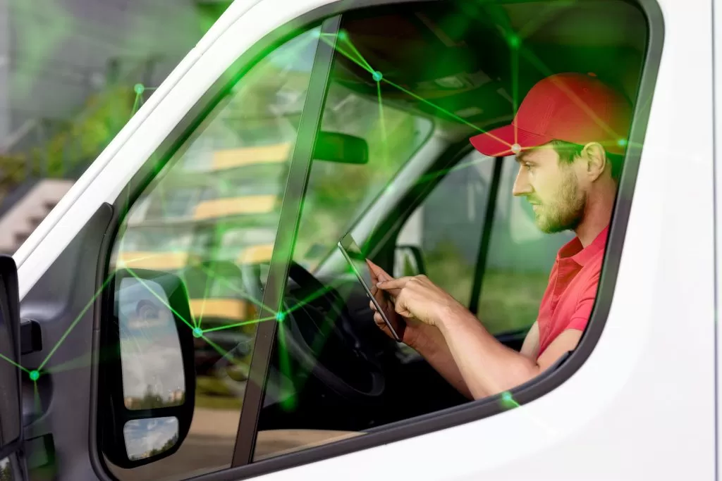 delivery man checking mobile green plexus