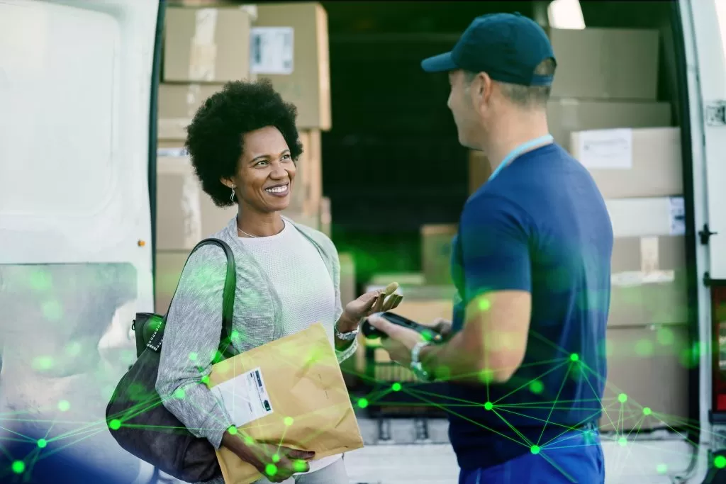 happy woman communicating with courier while getting her package delivered green plexus