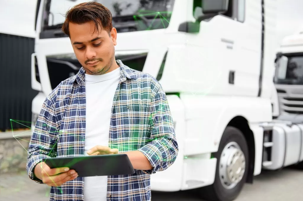 portrait truck driver managing fleet green plexus