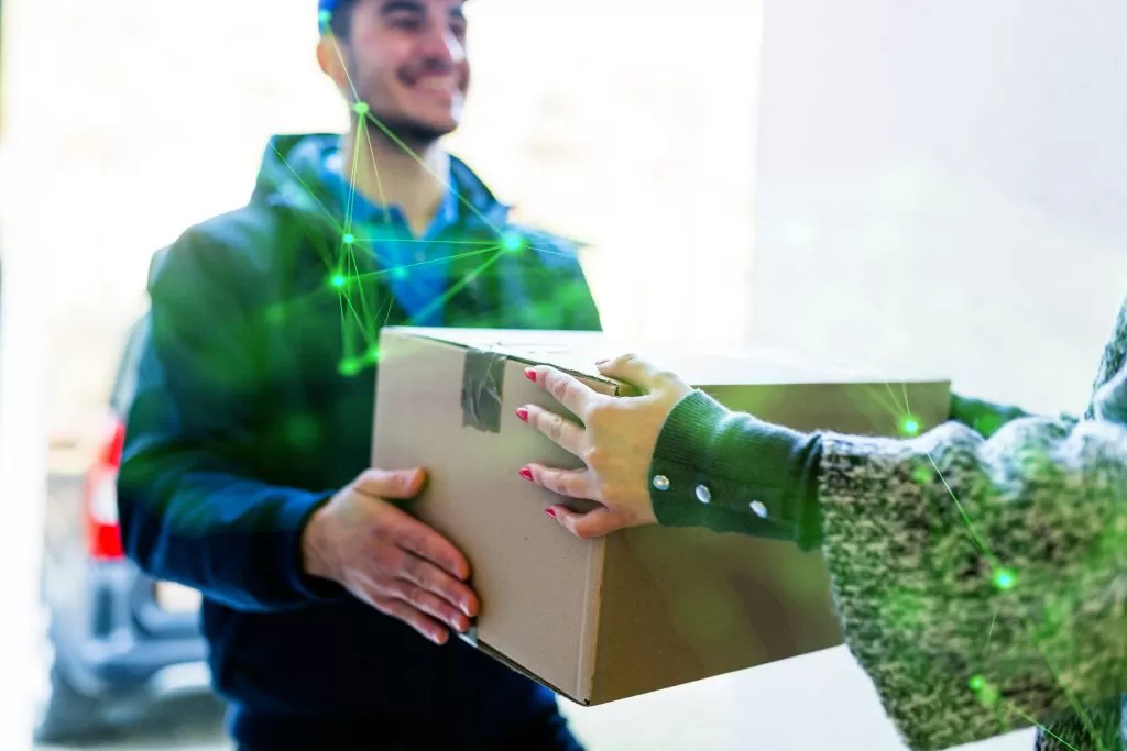 crop woman receiving mail box from courier green plexus