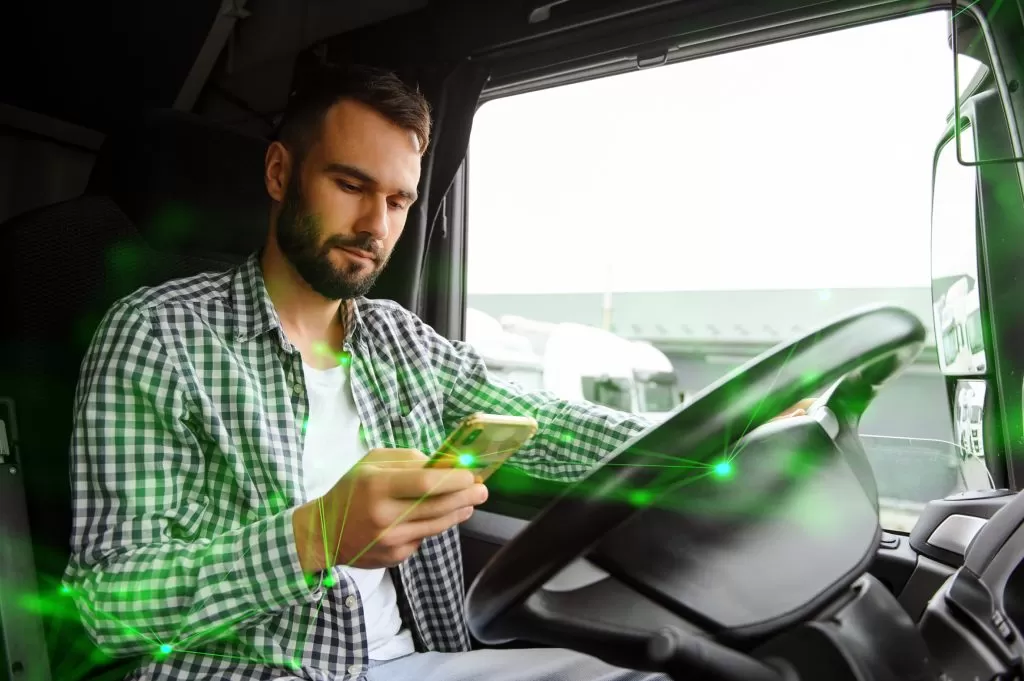 man using transportation app in lorry whilst driving with a green plexus overlay